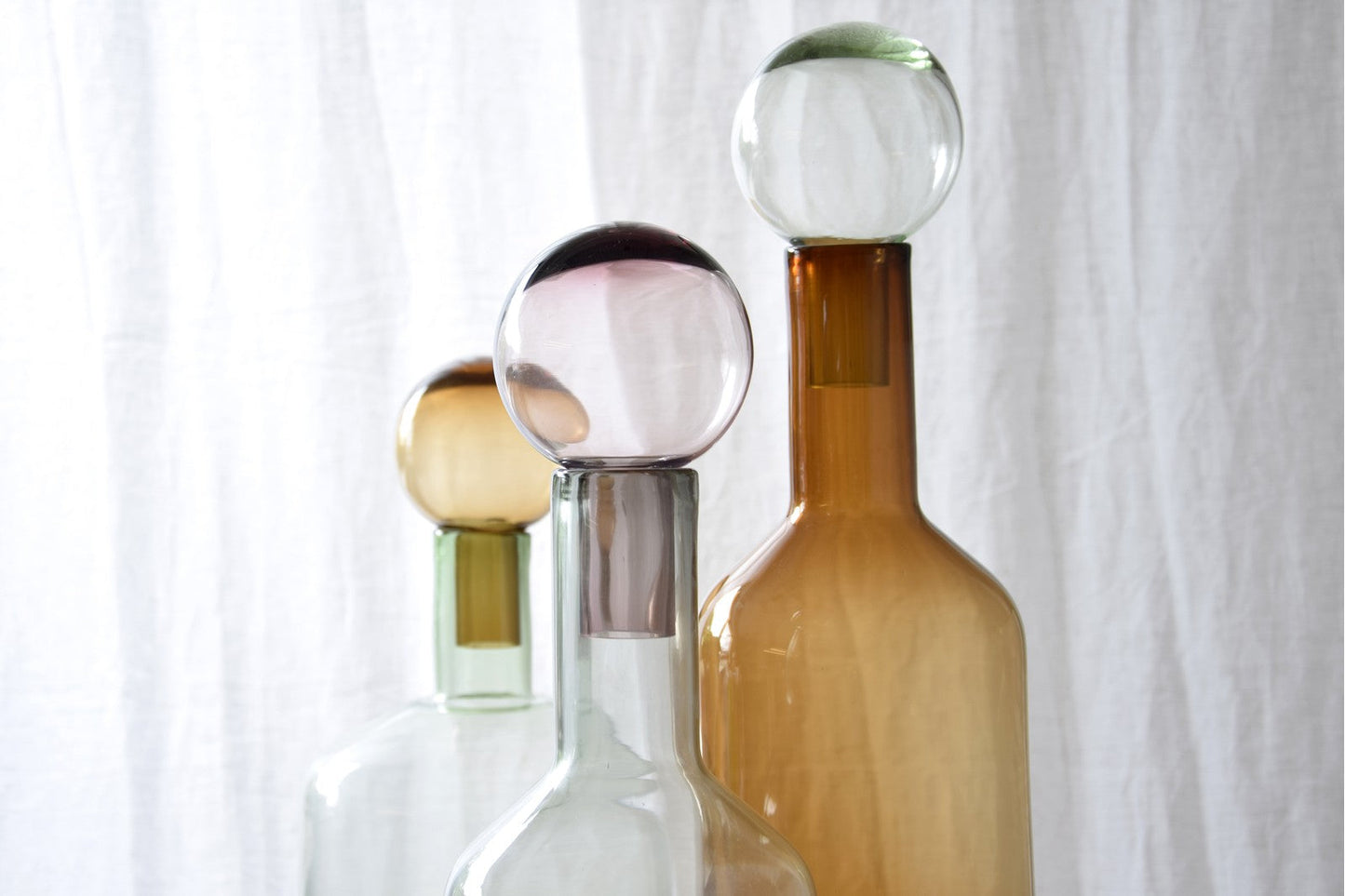 BOTELLA DE VIDRIO VERDE Y AMBAR PEQUEÑA
